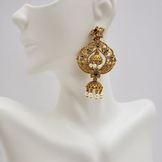 This beautiful earrings set has an excellent finish and gives out an exquisite sense of style. If you are looking for an amazing Fashion Jewelry set for special occasions such as Anniversary, Engagement, Party, Wedding, or for gifting, then your search ends here. Handmade Indian Temple Jewelry, best to wear it for traditional ceremonies or Indian wedding. This bridal jewelry has an ethnic finish. It has Cubic Zircon stones with semi-precious ruby and emeralds. It is a Bollywood style one gram je Gold Dangle Jhumkas For Wedding, Temple Jewelry Chandelier Earrings For Wedding, Elegant Silver Jeweled Danglers, Glamorous Metal Jewelry Sets For Wedding, Ornate Chandbali Jewelry Sets For Gift, Elegant Chandbali Pearl Earrings For Festive Occasions, Elegant Chandbali Pearl Earrings For Party, Elegant White Chandbali Earrings, Ornate Gold Chandbalis As Gift