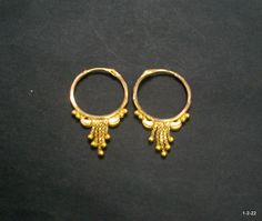 Vintage 18kt gold earrings earring pair from rajasthan india. great handmade design good for jewelry collection. It can be wear in nose as well. Note - please check pictures carefully for more details. Size - 2.8/1.8 cm. Weight - 1.960 grams. Metal - 18kt yellow gold. 22k Gold Jewelry With Matching Earrings For Puja, Gold Plated Round Earrings For Puja, Festive 22k Gold Traditional Earrings, Festive Traditional 22k Gold Earrings, Yellow Gold Temple Jewelry Earrings For Puja, Temple Jewelry Yellow Gold Earrings For Puja, Traditional Round Earrings For Puja, Gold Small Hoop Earrings For Festive Occasions, 22k Gold Latkan Earrings For Festivals