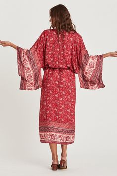 Behold a windswept bohemian beauty in Coa Kimono! Vibrant and floral sheer fabric flows to the beat of an artsy vibe. Thanks to its wing-like long sleeves and midi length, this kimono robe ensures full coverage for swim suit babes. Gracefully show your appreciation with Coa Kimonos as special bridal party gifts. Infuse down time with flower power. Details: bohemian style Coa Kimono long sleeves midi length matching waist sash colorful floral print fabric is sheer Fabric + Care: Rayon, Cotton blend. Machine wash with mild detergent. Tumble dry normal or line dry for best shape. Steam or iron to your liking. Coa Kimono, bohemian style fall outfit, cute fall outfit ideas, floral kimonos, pretty kimono robe, bridal party gifts, ShoptheKei.com Bohemian Flowy Long Sleeve Kimono, Bohemian Floral Print Robe For Festivals, Bohemian Floral Print Festival Robe, Bohemian Flowy Robe With Kimono Sleeves, Bohemian Printed Wrap Robe, Bohemian Long-sleeved Kaftan With Boho Print, Long Sleeve Boho Dress For Beach, Long Bohemian Robe For Spring, Bohemian Printed Maxi Length Kimono