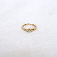 A sweet hand carved heart signet in 14k with white diamond or turquoise in center, perfect for showing your love! - 14k band - stone is 1.5mm - 4.3mm at the widest point, 1.9mm at the thinnest point of band Heirloom 14k Gold Heart Promise Ring, 14k Gold Signet Ring With Bezel Setting For Promise, Promise Stackable 14k Gold Signet Ring, Promise Stackable Signet Ring In 14k Gold, 14k Gold Heirloom Heart Promise Ring, Dainty 14k Gold Signet Ring For Promise, Carved Heart, Solitaire Ring, White Diamond