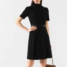 In The Cruise Collection, Alessandro Michele Included His Version Of The Little Black Dress. Emphasizing The Waist With A Slim Leather Belt Is The Guccio Gucci-Founded Label's Iconic Horsebit Gold Buckles (This Stirrup Decoration First Appeared In The 1950s). Gucci Black Viscose Dress With Horsebit Belt Wide Counter Pleats At Hem Short Sleeves Slim Leather Belt Horsebit Gold Buckles Made Of Soft Elastic Viscose Elastane (Polyurethane): 8%; Viscose: 75%; Polyamide: 17%; Size Xxs Product Number 59 Designer Knee-length Mini Dress For Work, Luxury Short Sleeve Formal Mini Dress, Luxury Mini Dress For Office, Designer Short Sleeve Mini Dress For Formal Events, Designer Short Sleeve Mini Dress For Formal Occasions, Gucci Mini Length Dresses, Gucci Knee-length Cocktail Dress, Gucci Fitted Mini Length Dresses, Designer Knee-length Formal Dresses