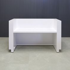 a white bench sitting on top of a cement floor