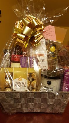 a gift basket filled with chocolates, candies and other treats for someone's special occasion