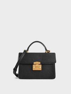 It doesn't get any more classic than this. Rendered in timeless black and featuring gold-tone hardware, this top handle bag will complement structured dresses and pencil skirts. Structured Dresses, Charles And Keith, Eyewear Chain, Structured Dress, Brand Collaboration, Chalk White, Charles Keith, Purse Styles, Pencil Skirts