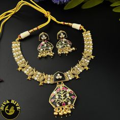 Our special Handcrafted fusion necklace is curated on brass ,hand painted and meena work on real stones pendant. This is a absolutely gorgeous and trending Piece.Metal: Brass with 92.5 SilverPolish: Gold Nickel FreePerfect for all occasion(Party, Wedding ,Engagement)Note: This product is handcrafted and vintage, it has slight irregularities in design which only add to its beauty. Due to the differences in displays of computers/laptops/phones or may be photographic lighting sources the color of t Meenakari Pendant Jewelry For Puja, Kundan Chandbali Necklaces For Gift, Kundan Chandbali Necklaces As Gift, Enamel Pendant Jewelry For Weddings, Enamel Pendant Jewelry For Wedding, Unique Hand Painted Necklaces For Festivals, Enamel Pendant Wedding Jewelry, Dual-tone Pendant Necklace As Gift, Dual-tone Pendant Necklace For Gift