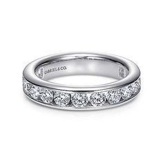 a white gold wedding band with channeled diamonds