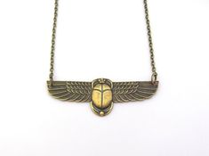 "Vintage design Egyptian Revival Scarab Pendant Necklace. Beautiful Antiqued brass. Ornate detailed Scarab, 2-3/8\" across. Antiqued brass finish brass chain with a lobster clasp. Handmade by me, on Maui, and sent to you with Aloha! #53 More of my Artisan Jewelry: hawaiibeads.etsy.com" Symbolic Stamped Gold Jewelry, Gold Brass Necklace With Antique Finish, Antique Finish Gold Necklace For Anniversary, Gold Necklaces With Antique Finish For Anniversary, Anniversary Gold Necklace With Antique Finish, Bronze Brass Necklace For Anniversary, Gold Stamped Metal Jewelry, Symbolic Metal Necklaces With Antique Finish, Antique Oxidized Gold Necklace