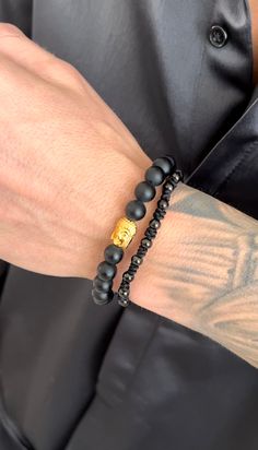 This Golden Buddha bracelet set is an adjustable beaded bracelet that shines with spiritual and cultural meaning. This "Awakened One" eight inch bracelet set is perfect for men and women's everyday wear to add some fresh detail to your wrist. (2 pc set) Great Holiday Gift Material: 18K Gold Plated on Stainless Steel. Tarnish and water resistant. ﻿ALL SALE ITEMS ARE FINAL SALE Adjustable Symbolic Gold Beaded Bracelets, Adjustable Rosary Bracelet For Healing With 108 Beads, Adjustable Gold Hand Wrapped Rosary Bracelet, Spiritual Friendship Bracelets With Round Beads, Spiritual Hand-strung Beaded Bracelets For Friendship, Resizable Spiritual Friendship Bracelets With Beads, Spiritual Resizable Friendship Bracelets With Round Beads, Casual Hand-strung Bracelets For Meditation, Spiritual Gift Braided Mala Beads Bracelet