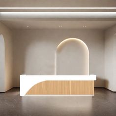 an empty room with white walls and arches on the wall is lit by recessed lights