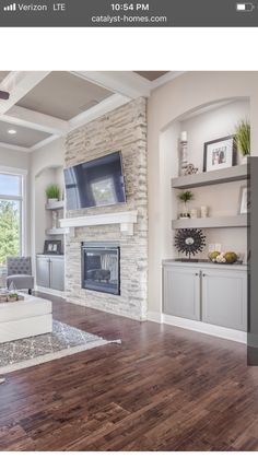 the living room is clean and ready to be used for tvs, fireplaces, and more