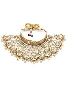 This jewelry set consists of a necklace, a pair of earrings, 2 hathphool bracelets and matha pattiGold-plated necklace has white kundan-studded and white pearls beaded detailsSecured with a drawstring closureA pair of matching drop earrings, each secured with a post-and-back closure2 matching hathphool bracelets, secured with a s-hook closureA matching Matha patti, secured with a hook closure Size & Fit Size of the necklace: 24 cm x 12 cm (Length x Width)Size of the earrings: 11 cm x 5.5 cm(Length x Width)Size of the Mathapatti: 11 cm x 23.5 cm(Length x Width)Size of the Hathphool: 13 cm x 16 cm (Length x Width) Material & Care Material: AlloyPlating: Gold-platedStone Type: Kundan and Beads Care InstructionsWipe your jewellery with a soft cloth after every useAlways store your jewellery in Adjustable Kundan Necklace With Tilla For Festivals, Adjustable Traditional Kundan Necklace With Stone Work, Traditional Adjustable Kundan Necklace With Stone Work, White Metal Bridal Necklace For Wedding, Festive Adjustable Kundan Necklace For Diwali, Adjustable Temple Style Kundan Necklace, Hand Set Ceremonial Jewelry For Navratri, Ceremonial Hand Set Jewelry For Navratri, White Beaded Jewelry Sets For Festivals