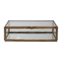 a glass and brass box with scalloped edges