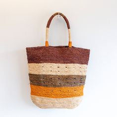 IN STOCK FAST SHIPPING FROM LOS ANGELES This large tote is the ultimate summer bag, perfect for a day at the beach or a casual chic outing. Made of natural soft raffia straw and accented with colorful stripes, this durable and fashionable tote is a must-have accessory. Stay on trend with this versatile and stylish bag. Dimensions: 16"H x 17"W Designer Style ID: 8634 Rectangular Brown Hobo Bag For Beach, Brown Bucket Crochet Bag For Beach Season, Beachy Brown Straw Bag With Braided Handles, Brown Beach Bag With Braided Handles, Brown Straw Bag For Beach Season With Handles, Brown Straw Bag With Handles For Beach Season, Brown Crochet Shopping Bag For Beach Season, Brown Hobo Tote Bag For Beach Season, Summer Brown Hobo Bag With Double Handle