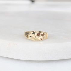 This tiny ring features a gold nugget design and has been crafted in 10k yellow gold. Perfect as children's ring this ring would also make a great pinky ring for smaller hands! Metals: solid 10k yellow gold (not gold filled, not gold plated) Please allow up to 5 business days for processing. Currently only shipping within Canada and the US. | c u r a t e d | Visit our website for curated and modern pieces  https://www.menkduke.com | f a c e b o o k | Follow us on Facebook for new item announceme Gold Nugget Ring, Tiny Rings, Kids Rings, Gold Nugget, Pinky Ring, Ring Unique, Gorgeous Necklaces, Solid Metal, Stackable Rings