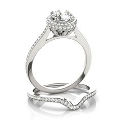 a white gold engagement ring with diamonds on it