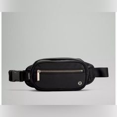 New With Tags. Lululemon Wanderlust Belt Bag. Size: 1.8 L. Color: Black Hold Your Essentials Close. Compact And Contoured To Hug Your Body For A Seamless Fit, This Bag Is Designed To Be Worn Around The Waist Or Over The Shoulder. Designed For Casual Water-Repellent Fabric Bag Dimensions: 31.5cm X 6.5cm X 14.5cm (12.4" X 2.6" X 5.7") Strap Length When Fully Extended: 124cm (48.8") Volume: 1.8l Product Features(Click To Close) Adjustable Strap Exterior Zippered Pocket To Secure Your Valuables Inte Black Hold, Lululemon Bags, Vegas Outfit, Festival Bag, Black Crossbody, Fabric Bag, Bags Purses, Everyday Bag, Volume 1