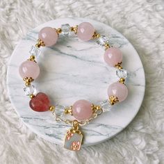 📝Material and Size Rose Quartz Beads: around 12mm Red Heart Bead is Strawberry Quartz 14k Gold Filled decoration beads Clear bead is Xilion Bicone (Also name as Swarovski crystal) Bracelet length: around 14cm 💜You will receive the exactly same bracelet as shown in the photo. 💜This handmade Jewelry listing come with an anti-oxidized jewelry box. 💜Please ensure you have no metal allergy before purchasing 💜Keep in mind these are natural stones and they may have small cracks and imperfections. Spiritual Heart Beads Bracelet Gift, Heart-shaped 8mm Bead Jewelry Gift, Spiritual Crystal Bracelet With Heart And Round Beads, Spiritual Beaded Bracelet With Heart Beads For Gifts, Rose Gold Jewelry With 8mm Beads For Gift, Rose Quartz Beaded Bracelets As Gift, Heart-shaped Gemstone Beads Bracelets For Gift, Crystal Bracelet With Heart Charm As Gift, Crystal Bracelet With Heart Charm For Gift