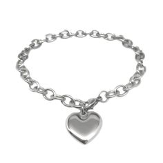 Great worn as is, can easily add charms too! This polished mirror finish stainless steel heart bracelet is a classic that will never go out of style. Since it is stainless steel, it is hypoallergenic (won't turn your wrists green), will never tarnish and is extremely durable. The chain measures a little under 1/2 inch in width with oval links. To clasp the bracelet at the end, measure your wrist, and add 1 inch. The bracelet is fully adjustable into any link in the cable chain but recommend orde Silver Heart Jewelry, Puffy Heart Charms, Silver Bracelets For Women, Bangle Bracelet Set, Charm Chain, Stainless Steel Bangles, Waterproof Jewelry, Silver Chain Bracelet, Metal Bracelets