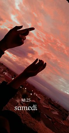 two hands reaching up into the sky with sunset behind them and words samedi below