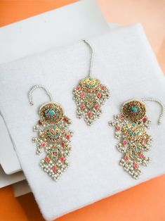 This multani work thapa kundan tikka and jhumka earrings set is gorgeous and very versatile to wear. The gold plating is traditional and the colors will match with any type of outfit. 22k Gold Meenakari Chandbali Jewelry Sets, Gold Chandbali Tikka With Zari Work, Gold Plated Meenakari Temple Jewelry Danglers, Traditional Gold Plated Meenakari Danglers, Traditional Meenakari Gold-plated Danglers, Traditional Meenakari Danglers In Gold Plated, Gold Plated Temple Jewelry Danglers With Stone Work, Festive Gold Plated Meenakari Danglers, Gold Kundan Danglers With Zari Work