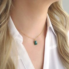 "I fell in LOVE with this stone the moment I had it! This sweet little emerald necklace is the perfect gift for a May birthday, someone with a green alma matter, or an emerald lover! It's hung on a satellite chain for a little extra texture - a beautiful conversation starter. Shop Landon Lacey Jewelry » www.etsy.com/shop/landonlacey it's in the DETAILS . . . » Gold filled or sterling silver satellite chain » Genuine raw emerald quartz gemstone, polished and faceted » The model is petite and is w Minimalist Emerald Clavicle Necklace As Gift, Minimalist Emerald Necklace Clavicle Chain As Gift, Delicate Charm Necklaces With Natural Stones For Gift, Green Natural Stones Necklace For Anniversary, Dainty Necklaces For May Birthstone Gifts, Dainty Necklace For May Birthstone Gift, Green Natural Stone Necklace For Anniversary, Dainty May Birthstone Necklaces For Gifts, Green Necklaces With Delicate Chain For Anniversary