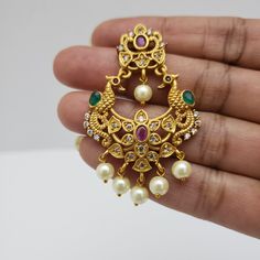 This beautiful earrings set has an excellent finish and gives out an exquisite sense of style. If you are looking for an amazing Fashion Jewelry set for special occasions such as Anniversary, Engagement, Party, Wedding, or for gifting, then your search ends here. Handmade Indian Temple Jewelry, best to wear it for traditional ceremonies or Indian wedding. This bridal jewelry has an ethnic finish. It has Cubic Zircon stones with semi-precious ruby and emeralds. It is a Bollywood style one gram je Gold Peacock Design Jewelry Sets For Weddings, Traditional Gold Bridal Earrings With Peacock Design, Temple Jewelry Chandbali Bridal Earrings With Elegant Design, Temple Jewelry Bridal Chandbali Earrings With Elegant Design, Gold Plated Temple Style Bridal Earrings, Gold Peacock Temple Jewelry Bridal Earrings, Elegant Temple Jewelry Chandbali Bridal Earrings, Gold Bridal Earrings With Peacock Design For Diwali, Gold Temple Jewelry Bridal Earrings With Peacock Design