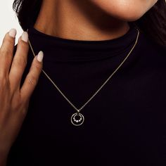 The Cloud Double Ring Pendant Necklace displays the shared prong motif ring and larger solid gold ring. It's the perfect gift for someone special. SKU #P385 15mm x 1mm ring and 9mm x 2mm diamond ring pendant 1.5mm cable chain adjustable from 18”-20” 0.21ctw 14K yellow or white gold White Gold Jewelry With Single Cut Diamonds As Gift, Elegant Round Pendant Jewelry With Polished Finish, Gold Plated Diamond Necklace With Round Pendant For Anniversary, Timeless Pendant Jewelry For Anniversary, Modern Yellow Gold Diamond Necklace For Anniversary, Polished Pendant Jewelry For Anniversary, Elegant Tarnish Resistant Diamond Necklace For Anniversary, Diamond White Tarnish Resistant Jewelry For Anniversary, Yellow Gold Jewelry With Brilliant Cut For Gift