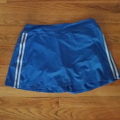 This Victoria's Secret Sport Tennis Skirt Comes With Built In Spandex Shorts. The Back Is Pleated For Extra Shape. Never Worn! Sporty Blue Skort With Built-in Shorts, Sporty Blue Short Length Skort, Blue Swim Skirt With Built-in Shorts, Sporty Stretch Blue Swim Skirt, Blue Sporty Swim Skirt, Sporty Blue Short Swim Skirt, Blue Sporty Swim Skirt With Built-in Shorts, Blue Stretch Swim Skirt Casual Style, Blue Stretch Casual Swim Skirt