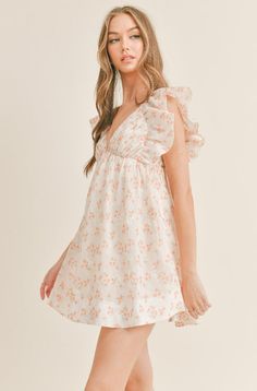 Flirty Flowy Floral Print Dress, Feminine Flowy Mini Dress For Garden Party, Feminine Lined Sundress For Casual Wear, Cute Flowy Party Dress, Peach V-neck Spring Dress, Chic Spring Ditsy Floral Dress, Chic Spring Floral Dress With Ditsy Print, Feminine Ditsy Floral Print Dress, Casual Feminine Ditsy Floral Dress