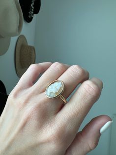 Vintage 10k Bezel Carved Natural Shell Cameo Ring Description: This vintage 10k ring features a carved natural shell cameo set in a bezel, adding a unique touch to your collection. Sized at 8 and weighing 4.31g, the shell's unique tone makes this ring a standout piece. As with all our pieces, this ring is a rare find—once it's gone, it's gone. Choosing this piece helps you stand out from the crowd while supporting sustainable practices. Why You'll Love It: Unique Design: The carved shell cameo a Cameo Ring, Carved Shell, Sustainable Practices, Timeless Treasures, Turks And Caicos Islands, Accessories Jewelry, Trinidad And Tobago, Ring Necklace, Jewelry Pieces