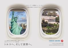 an airplane window with the statue of liberty in it