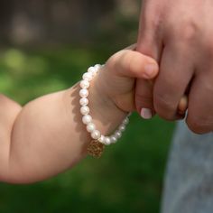 Our favorite classic pearls styled for Mommy & Me. How sweet to dress up with matching bracelets knowing they represent your special love for each other. Bracelets are created with 6mm freshwater pearls and 14k gold filled accent bead. Mommy heart is hand hammered and approximately 1" across. Mini styles have a smaller sized heart approsimately 1/2" across. Easy wear and effortless bracelet stacking with stretch cord design. Bracelet is made to fit an average 7" wrist for mommy. Select your choi Elegant Personalized Pearl Bracelet For Everyday, Elegant Everyday Personalized Pearl Bracelet, Adjustable Hypoallergenic Pearl Bracelet For Mother's Day, Personalized Adjustable Classic Pearl Bracelet, Classic Personalized Adjustable Pearl Bracelet, Classic Adjustable Personalized Pearl Bracelet, Personalized Round Beads Pearl Bracelet For Everyday, Adjustable Hypoallergenic Pearl Bracelet For Anniversary, Elegant Adjustable Hypoallergenic Heart Bracelet