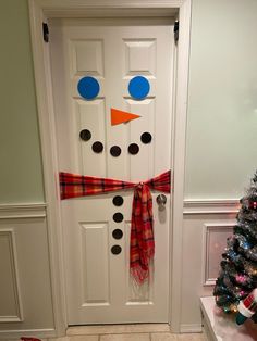 Ready to hang snowman. Everything you need to turn your door into a statement piece.  The pieces are laminated to last for years.  Great gift for adults or kids. Easy to store away at the end of the season.  Kit includes sticky tack to hang, paper eyes, nose, mouth, and buttons all laminated, red buffalo plaid fabric scarf and a sample picture to make for an easy build.  It is recommended to be hung on an inside white door. It can be used outside, however you might want to hang the pieces with s Easy Door Christmas Decorations, Door Snowman Decoration, Gift Wrap Door Decoration, Snowman Door Decor, Snowman Hallway Decorations, Easy Door Decorations Christmas, Decorating Doors For Christmas, Christmas Teacher Door, Snowman Door Decoration For Classroom