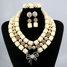 Elevate your Nigerian wedding or party look with this Bead Jewelry. Handcrafted with care, these jewelry pieces add a touch of color and cultural significance to your ensemble, making you stand out with traditional elegance. Traditional White Polished Beads Jewelry, Traditional Decorative Wedding Jewelry, Traditional White Jewelry Sets With Polished Beads, Traditional Beaded Jewelry For Ceremonies, Traditional White Beaded Necklace For Formal Events, Traditional White Beaded Necklace For Formal Occasions, White Beaded Jewelry Sets For Festivals, Traditional White Beaded Formal Necklace, Traditional Round Beads Jewelry For Ceremonies