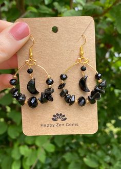 This listing is for a pair of beautifully Witchy, Whimsy Goth Black Onyx Moon Hoop Earrings. Each pair of earrings features genuine Onyx stones as well as black crystals and gold accents for an added sparkle. The wire used in these earrings is gold-colored copper wire.  ･ ｡ﾟ☆: *.☽ .* :☆ﾟ. Onyx is the stone of protection, strength, and willpower. Onyx is an excellent stone in providing one with the ability to pursue their goals and dreams but also protects its wearer along the way. Wearing Onyx provides its wearer with a protective shield, deflecting any negative energy that may come your way.  ･ ｡ﾟ☆: *.☽ .* :☆ﾟ. ☆Care instructions☆ We highly recommend avoiding water and direct sunlight, as prolonged exposure to either can cause the silver and copper to tarnish. ☽Thank you for visiting Happ Hoop Earrings With Crystals, Small Black Hoop Earrings For Jewelry Making, Black Small Hoop Earrings With Ear Wire, Nickel-free Black Small Hoop Earrings, Handmade Black Crescent Earrings, Nickel-free Small Hoop Black Jewelry, Adjustable Small Hoop Black Jewelry, Adjustable Black Small Hoop Jewelry, Black Adjustable Crescent Jewelry