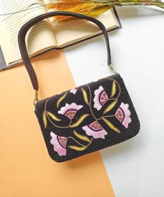 Floral Embroidered Handbag - Elegant Black Purse with Pink & Green Flower Design - Unique Women's Fashion Accessory Step out in style with this beautifully crafted black handbag, adorned with intricate embroidery of pink and yellow flowers. This unique purse is not just a fashion statement but also a testament to exquisite craftsmanship. The vibrant floral pattern stands out against the classic black background, making it the perfect accessory for any outfit. Size: 8 inches by 5.5 inches Weight: Witchy Fits, Seed Bead Purse, Beaded Shoulder Bag, Unique Womens Fashion, Bridal Handbags, Embroidered Handbag, Floral Handbags, Bag Flower, Black Crossbody Purse