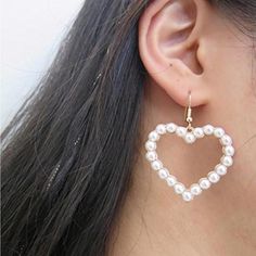 Unbranded Faux Pearl Heart Drop Earrings Heart Dangle Pierced Earrings New White Pearls Heart Motif Fashion Drop Earrings. Versatile Can Be Worn Dressed Up Or Casual. New In Original Packaging. Goldtone Faux Pearls Fish Hook Heart Dangle Earrings Earring Length - 6 Cm, Width - 4.5 Cm Imported White Heart Drop Earrings For Party, Trendy White Heart-shaped Earrings, White Heart Charm Earrings For Party, White Heart-shaped Pearl Drop Earrings, White Open Heart Earrings For Valentine's Day, Valentine's Day White Pearl Drop Heart Earrings, Valentine's Day White Heart Earrings With Pearl Drop, Valentine's Day White Open Heart Earrings, White Heart Bead Earrings For Party