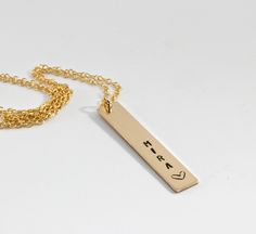 Personalized vertical bar necklace hand stamped gold filled bar and gold filled chain. Unique , trendy and inspirational. Gold bar 1.2" (30mm) long and you can choose chain lenght from drop down menu. This is custom hand stamped gold filled bar. *Approx 10-12 characters so please choose your name , quote or message. All of my metals 100% recycled . Meltem♥ ------------------------------ Thanks for visiting Melt'm Design Studio Custom Bar Necklace, Gold Initial Ring, Vertical Bar Necklace, Bar Necklace Personalized, Vertical Bar, Graduation Gifts For Her, Personalized Pendant, Initial Ring, Gold Bracelet Chain