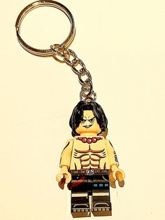 a lego keychain with a skeleton on it