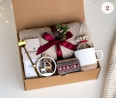 a christmas gift box with coffee, cookies and other items