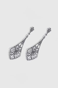 This sumptuous piece of jewelry features a retro-elegant yet slightly modern style that complements the lavish garments, reminiscent of the roaring 1920s. Features: High quality crystals rhinestones Classic art deco design Baroque exaggerated earrings 3.23 inch / 8.2 cm x 0.9 inch / 2.3 cm Ornate Chandelier Earrings For Formal Occasions, Silver Glamorous Chandelier Earrings For Formal Occasions, Silver Crystal Earrings For Evening, Classic Chandelier Earrings With Diamond Accents For Evening, Elegant Rhinestone Jewelry For Vintage Events, Glamorous Metal Bridal Earrings For Evening, Classic Silver Chandelier Earrings For Evening, Vintage Silver Chandelier Earrings For Formal Occasions, Elegant Filigree Chandelier Earrings For Formal Occasions