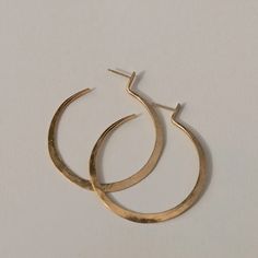 Handcrafted from brass and sterling silver posts coated in a luxuriously thick layer of 14k recycled gold. "Lenga" means "Create" in Tumbuka, the language of Northern Malawi. Dimensions: 2"L IMPACT YOUR HOME. EMPOWER COMMUNITIES. Handmade and ethically sourced in Malawi, Africa. Due to the handmade nature of this product, slight variations and imperfections may be present. S&Co strives to empower women and communities through dignified, consistent employment and reinvests 100% of the net proceed Everyday Hoop Jewelry In Recycled Gold, Everyday Recycled Gold Hoop Jewelry, Tarnish Resistant Small Hoop Jewelry In Recycled Gold, Handmade 14k Gold Earrings For Everyday, Gift Tarnish Resistant Recycled Gold Hoop Earrings, Gift Recycled Gold Tarnish Resistant Hoop Earrings, Modern Gold Hammered Hoop Earrings, Gift Recycled Gold Tarnish-resistant Hoop Earrings, Gold Crescent Hoop Earrings In Brass