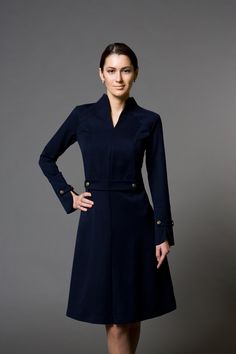 "A beautiful structured dress featuring high neck collar, a-line silhouette, and long sleeves. - high neck (stand collar) - trapeze skirt with inverted front pleat - long sleeves with elegant cuffs - knee length (midi) - a line silhouette - the dress is decorated with high-quality metal buttons Perfect as party, modest bridesmaid or elegant office dress. Seasons: autumn, winter, spring. Color: Blue / Black / Mustard / Burgundy / Grey Fiber: viscose - 60%, elastan - 5%, polyester - 35% Concealed Wedding Guest Fall, Jumpsuit Wedding Guest, Italian Costume, Long Sleeve Cocktail Dresses, Kibbe Dramatic Classic, Workplace Fashion, Jumpsuit Wedding, Stile Casual Chic, Beautiful Cocktail Dresses