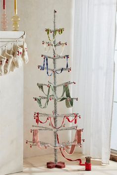 a small christmas tree decorated with ribbons