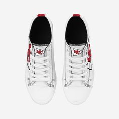 Low tops. High spirits. No matter the final score, you'll always be winning with the Kansas City Chiefs Women's Big Logo Low Top White Canvas Shoes on your feet. Features All-over white design so you can rep the team in style Team logo displays on tongues, in case there were any doubts where your allegiances lie Bold team logo displays on outer sides for a little extra team spirit Team-colored stripe accents on midsoles and heels for added fan fashion Adjustable laces for security Closed, round Sporty Lace-up High-top Sneakers For Sports Events, White Sneakers With Logo Print For Sports, Mid-top High-top Sneakers With Logo Print For Sports, Casual White Basketball Shoes For Sports Events, Casual High-top Sneakers For Sports Events, Low-top Basketball Shoes With Logo Print, Graphic Print Skate Shoes With Round Toe, White Round Toe Skate Shoes For Sports, Mid-top Logo Print Sports Sneakers