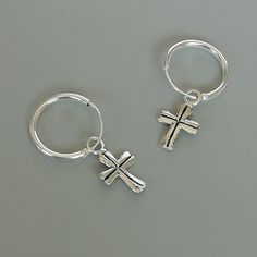 Comes with a detachable cross charm. The charm is multipurpose and can be used with a neck or bracelet chain too. Dimension: Hoop- 12 x 1.2 mm Cross: 7 x 12 mm Weight: 0.70gm Price listed is for a PAIR of hoops. These earrings are made of 925 hypoallergenic sterling silver and comes with a 925 stamp. Can be packaged in a gift box. I can include a personal message from you if needed You are welcome to contact me at... bhavnakwintra1956@gmail.com For more beautiful pieces from my shop, please brow Silver Nickel-free Huggie Hoop Earrings, Nickel-free Silver Dangle Huggie Earrings, Silver Nickel-free Dangle Huggie Earrings, Silver Dangle Huggie Earrings Nickel-free, Adjustable Sterling Silver Huggie Earrings, Nickel-free Small Hoop Sterling Silver Earrings, Small Hoop Nickel-free Sterling Silver Earrings, Nickel-free Small Hoop Earrings In Sterling Silver, Small Hoop Sterling Silver Nickel-free Earrings