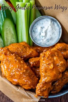 chicken wings with ranch sauce and celery sticks