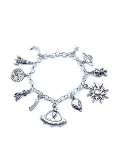 New. This Bracelet makes a perfect gift. Has  11 Alien UFO Themed Charms all charms are approx 1/2" to 1" in size Stainless Steel bracelet has a lobster clasp closure and is adjustable measures approx 8" bracelet is Stainless Steel  charms are silver tone alloy and steel. (Nickel and lead free) Adjustable Symbolic Metal Charms, Novelty Metal Jewelry With Charms, Adjustable Novelty Charm Bracelet, Adjustable Themed Jewelry With Dangling Charms, Themed Adjustable Jewelry With Dangling Charms, Novelty Charms Bracelet Jewelry, Silver Novelty Bracelets With Charms, Novelty Jewelry Charms Bracelet, Novelty Silver Hypoallergenic Bracelets