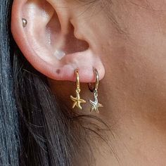 Unlock the celestial magic and let your style shine  ✨ Embrace the cosmic energy and let these earrings inspire wonder and connection to the universe.💫 Check what's cool about it 😎 🌙 Crescent moon, starfish, and star charms ✨ 18K gold vermeil over sterling silver 💫 Secure and comfortable huggie hoops ⭐ Unisex design 🎁 Charming packaging Something you must know... 👀 As part of our commitment to sustainable fashion and fair trade practices, we responsibly source our materials, focusing on hy Celestial Adjustable Hoop Earrings, Adjustable Celestial Hoop Earrings, Celestial Yellow Gold Tarnish-resistant Hoop Earrings, Celestial Gold Dangle Hoop Earrings, Celestial Gold Plated Tarnish Resistant Hoop Earrings, Celestial Gold-plated Tarnish Resistant Hoop Earrings, Celestial Gold-plated Tarnish-resistant Hoop Earrings, Gold Celestial Small Hoop Earrings, Celestial Hoop Jewelry Tarnish Resistant