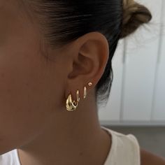 a close up of a person wearing earrings